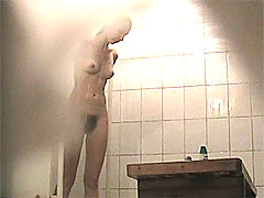 Young doll grooms her slit in spycammed showers voyeur video #3