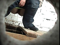 Careless chicks taking a leak in old country loo voyeur video #1