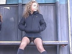 Upskirt gallery with curly haired schoolgirl in fishnets hunted down and filmed voyeur video #2