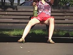 Hidden upskirt video of amateur girl flashing her pussy when resting on the bench voyeur video #2