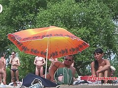 Hot summer voyeur hidden videos that were made on nudist beach will bring you enjoyment voyeur video #1