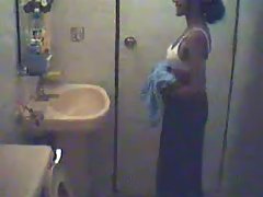 Mature housewife taking her clothes off in shower voyeur video #1