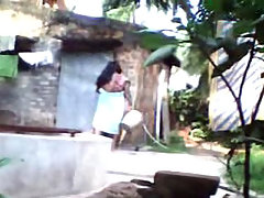 Desi wife taking shower in open air voyeur video #1