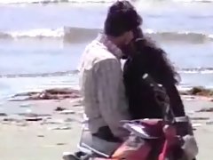 Young couple having a fun on see beach voyeur video #1